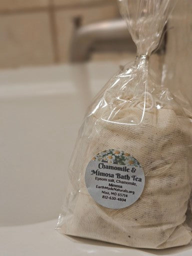 Bath tea package with a label on a bathroom counter