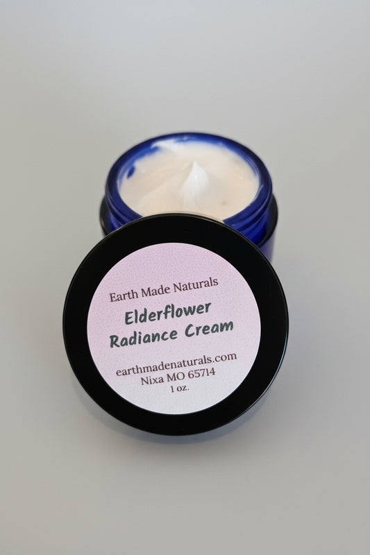  Earth Made Naturals Elderflower Radiance Cream on a wooden surface.