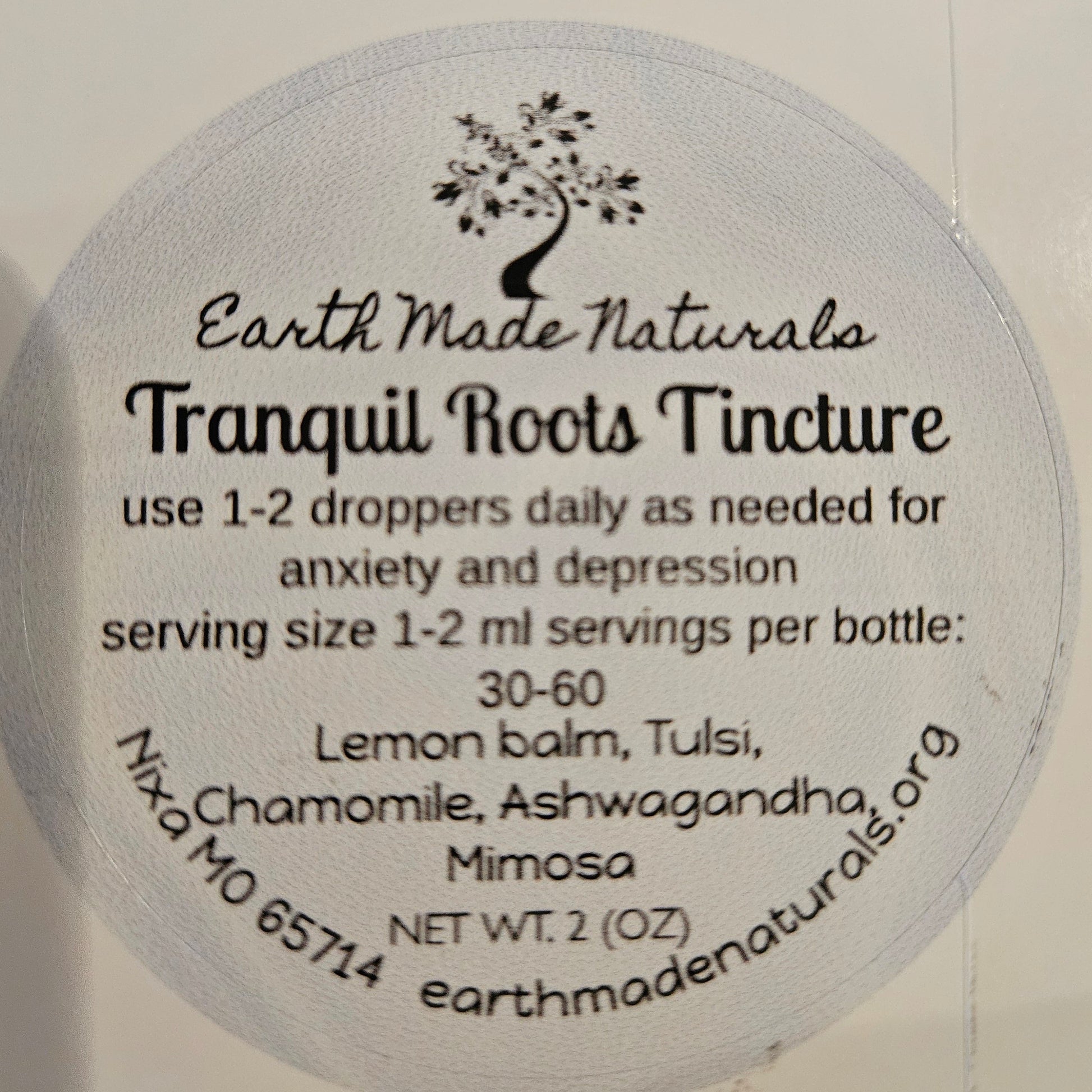 Round label  of tranquil roots tincture with text on a white background