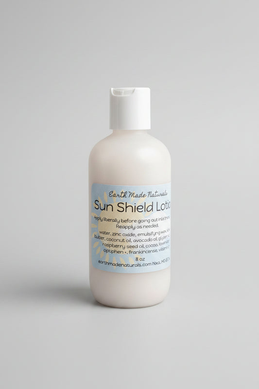 Sun shield lotion bottle with label on a textured beige background