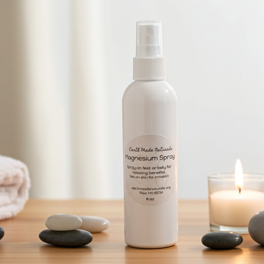 White magnesium spray bottle on a wooden surface with stones and a candle in the background