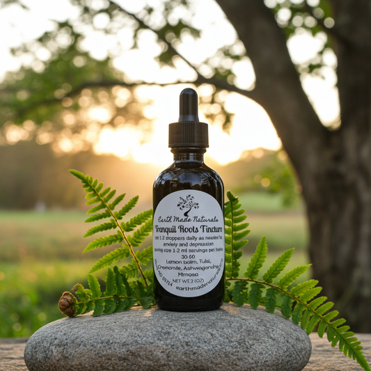 Bottle of Tranquil roots herbal tincture with a dropper on a rock outdoors