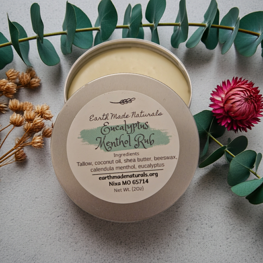 Container of Earth Made Naturals Eucalyptus Menthol Rub with decorative elements on a light background