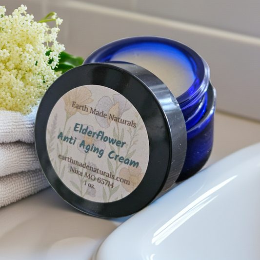 Earth Made Naturals Elderflower Anti Aging Cream jar with blue lid on a white surface.